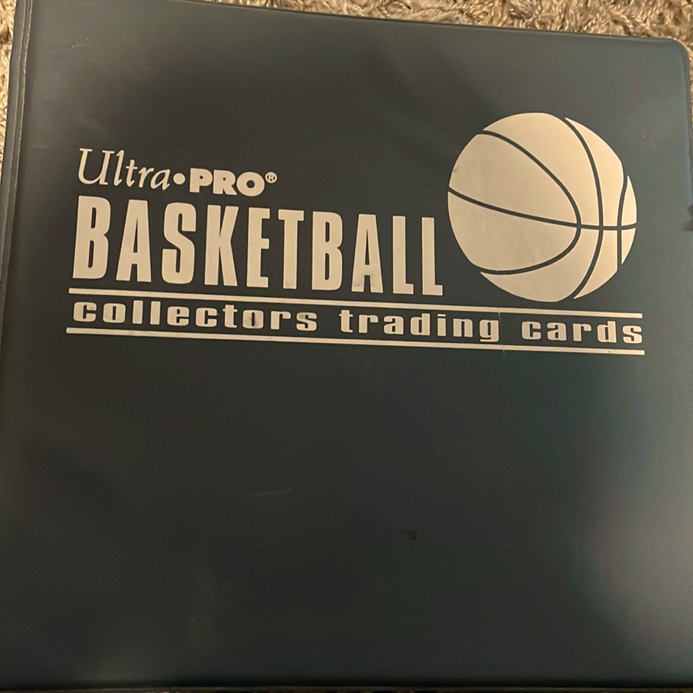 Binder full of basketball and football cards